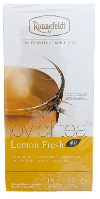 Die Verpackung von Ronnefeldt Joy of Tea "Lemon Fresh". Das obere Drittel ist weiß mit dem ovalen Ronnefeldt-Logo. Darunter zeigt ein Foto eine gefüllte Glastasse. Der untere Teil ist gelb mit dem Schriftzug "joy of tea®", "Lemon Fresh" und einem schwarze