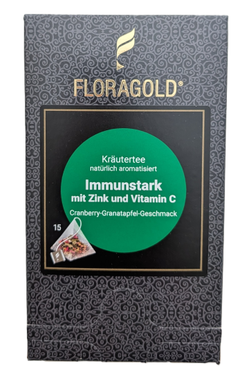 Die Verpackung von FLORAGOLD Kräutertee "Immunstark". Sie ist dunkelgrau mit einem goldenen Ornamentmuster. Oben ein goldenes geflügeltes Logo und der goldene Schriftzug "FLORAGOLD". Mittig ein schwarzes Quadrat mit einem tiefgrünen Kreis. Weißer Text dar